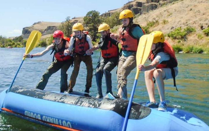 girls practice rafting skills on outward bound course